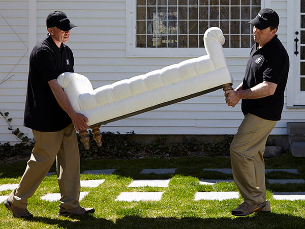 men carrying sofa