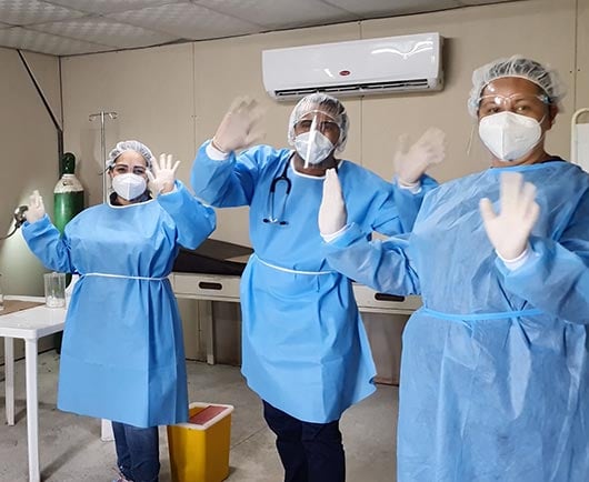 doctors smiling and waving