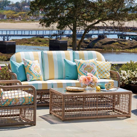 blue and yellow wicker outdoor living room